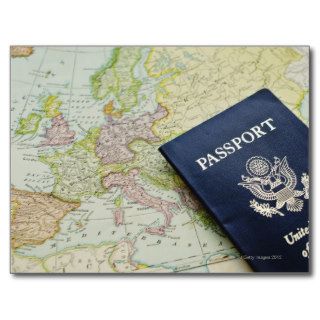 Close up of passport lying on European map Postcard