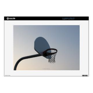 A basketball backboard hoop and net. Clear blue Skins For Laptops