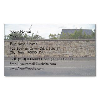 Beautiful Shot of Stone Wall and Plants Against Bl Business Card Templates