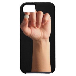 Persons hand holding a white pill between the iPhone 5 case
