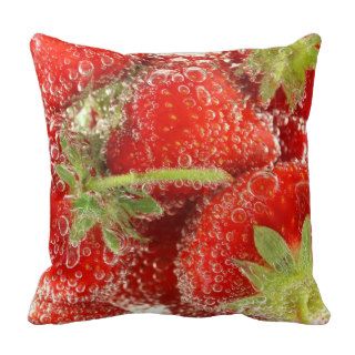 Strawberries being washed macro throw pillow