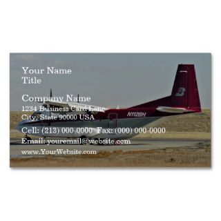 Airplane at airport with blue sky in background business card