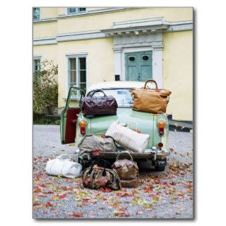 Vintage car with lots of luggage postcard