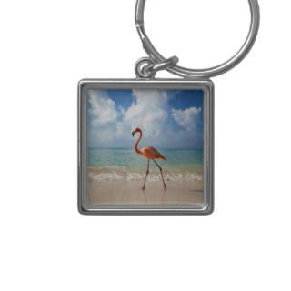 Flamingo walking along beach key chains