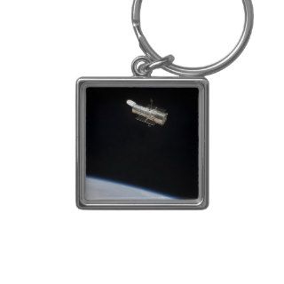 The Hubble Space Telescope in orbit above Earth 2 Key Chains