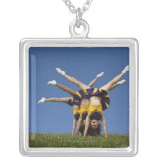 Female cheerleaders doing handstands custom jewelry