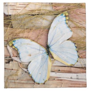 Collage of butterfly, straw and birch tree bark napkin