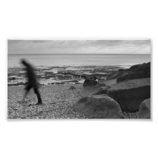 Man Walking along Pebble Beach   Black and White Posters