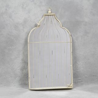 large white birdcage mirror by daisy west