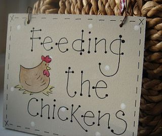 ' feeding the chickens' sign by little bird designs