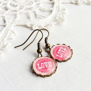pink 'love' earrings by pomegranate prints