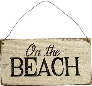 vintage style 'on the beach' sign by delightful living