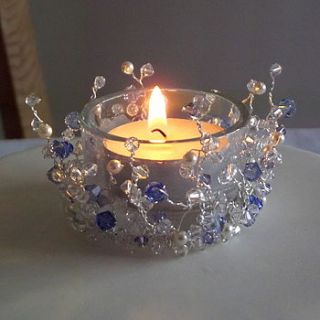 hand beaded cake topper with candle by cat's whiskers cake design