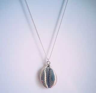 cowrie shell pendant by fou jewellery