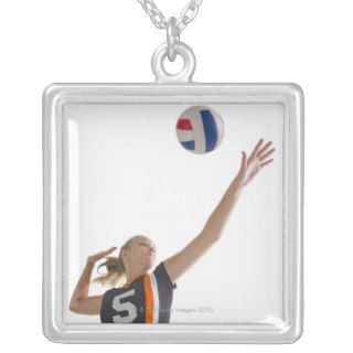 Young girl (16 17) playing volleyball jewelry