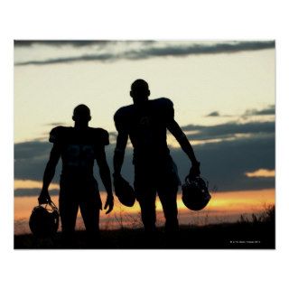 Silhouette of Black football players carrying Posters