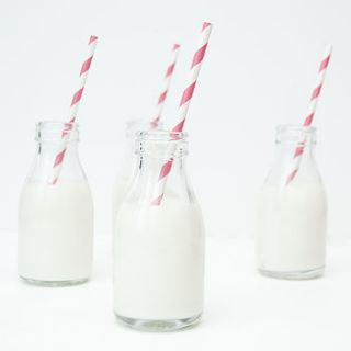 milk bottles by peach blossom