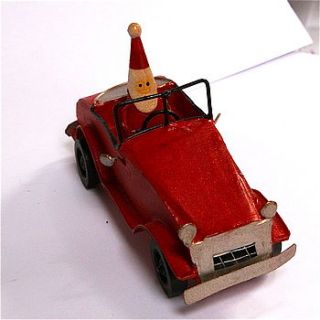 santa driving vintage red car decoration by london garden trading