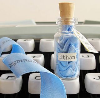 new baby message in a bottle by little white dog