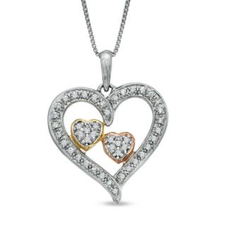 CT. T.W. Diamond Embracing Hearts Pendant in Sterling Silver and