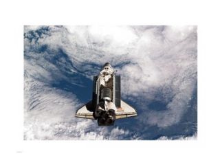 STS 135 Atlantis during the Rendezvous Pitch Maneuver Poster Print (24 x 18)